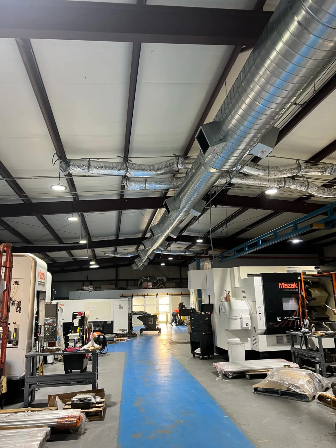 Industrial spiral ductwork in a machine shop